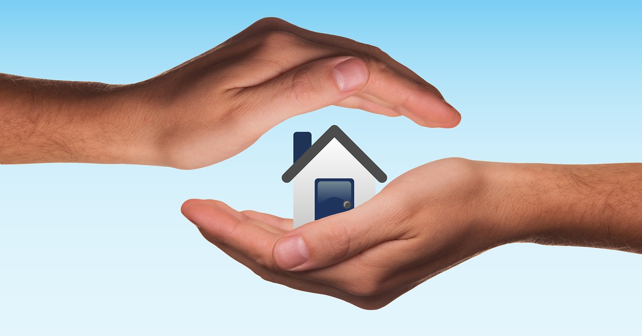 Hands protecting home